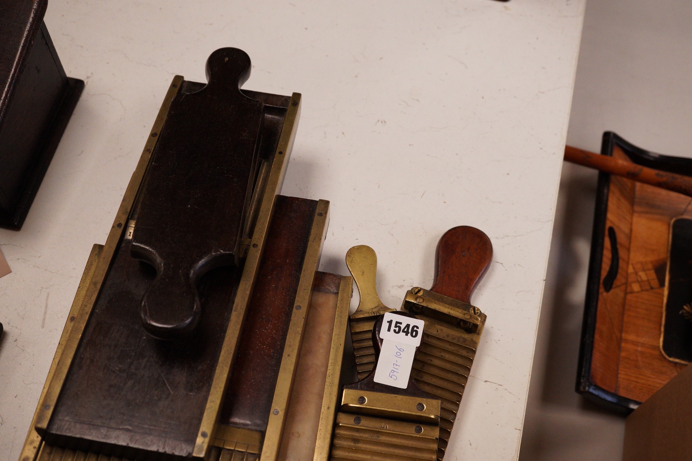 A collection of 19th century brass and mahogany chemist’s pill press rollers, Drury Lane marked examples etc